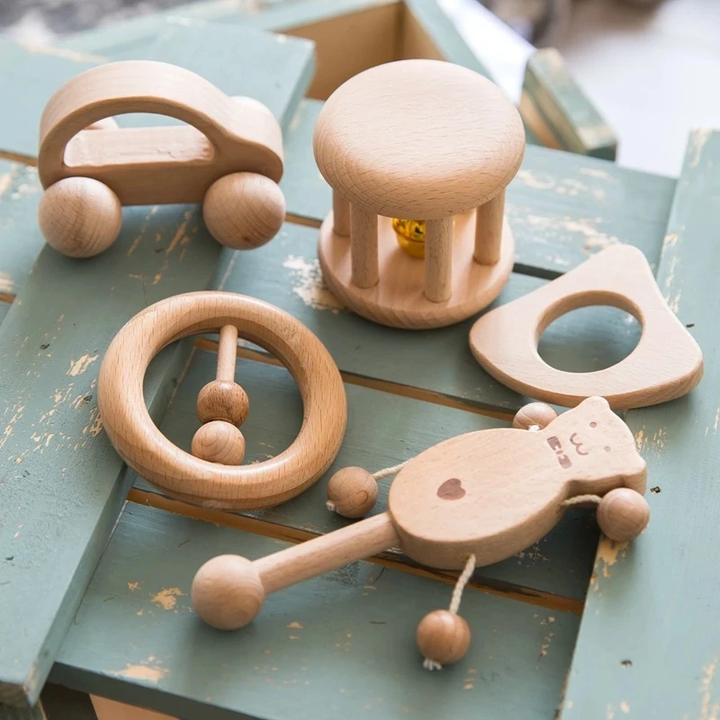 H1819d19abd5d4f21ae47d43ad466e87bU-1.webp 1pc Baby Toy Beech Bear Hand Teething Baby Rattles Wood Ring Cartoon Car Play Gym Montessori Stroller Toy Educational Toys - Image 1